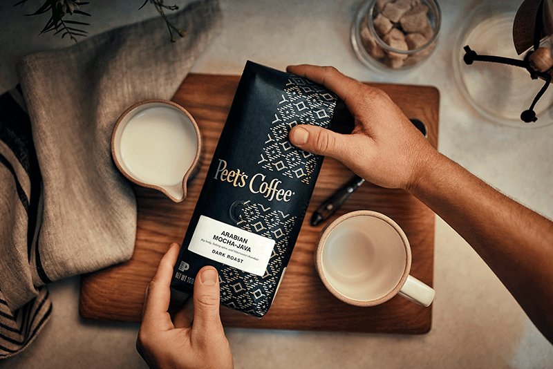 Person holding Peet's Brand of Coffee, Office Coffee, Peets, Starbucks, Green Mountain, Keurig, K Cups, K-Cups, Folgers, Maxwell House, Drip, Whole Coffee Beans, Coffee distributor
